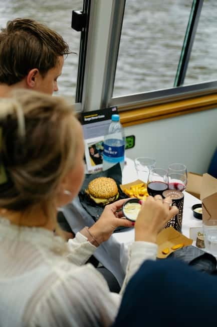Amsterdam canal cruise with culinary burger or cheese & wine - What the host and skipper add