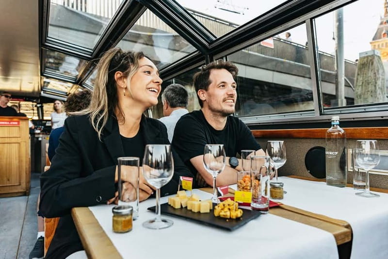 Amsterdam: Cozy Cheese & Wine Cruise Tasting Experience - Damrak and Amsterdam Centraal from the water