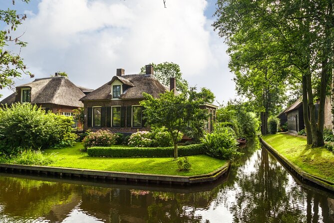 Amsterdam: Giethoorn Tour Scenic Cruise, Cheese & Free Time - Leaving Amsterdam by luxury coach
