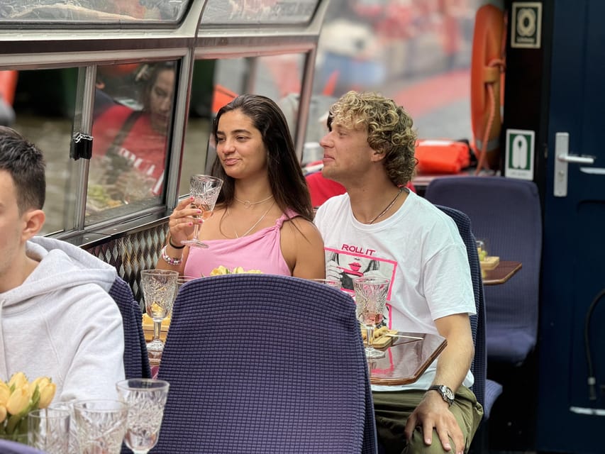 Amsterdam: Luxury Cheese & Wine Canal Cruise - Stories, atmosphere, and the human touch