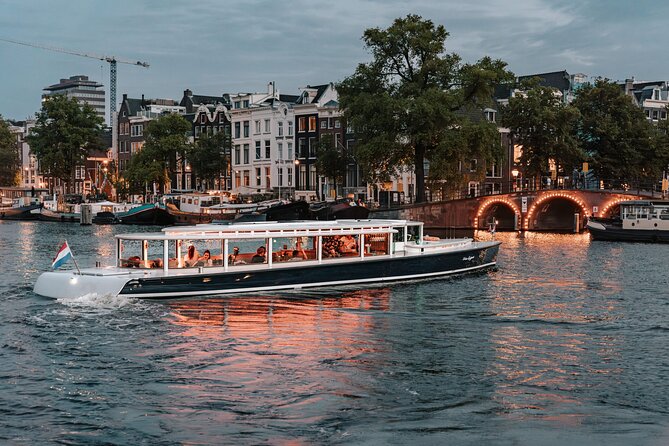 Amsterdam Small-Group Evening Canal Cruise Including Wine, Craft Beer, Cheese - A route shaped by light, not a fixed checklist