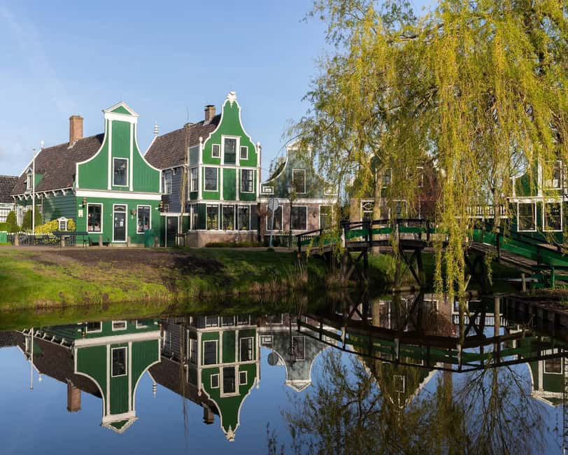 Amsterdam: Zaanse Schans, Cheese Tasting & Volendam Tour - Leaving Amsterdam for the windmills