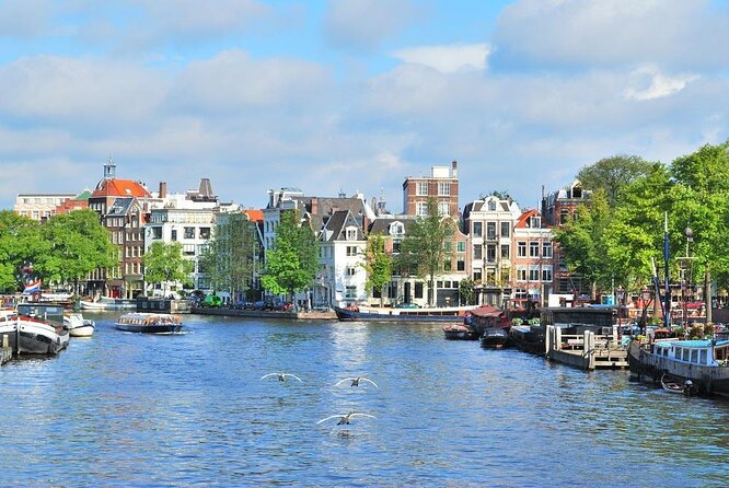 Countryside Bike Tour from Amsterdam: Cheese, Clogs & a Windmill - Leaving Amsterdam by ferry and bicycle