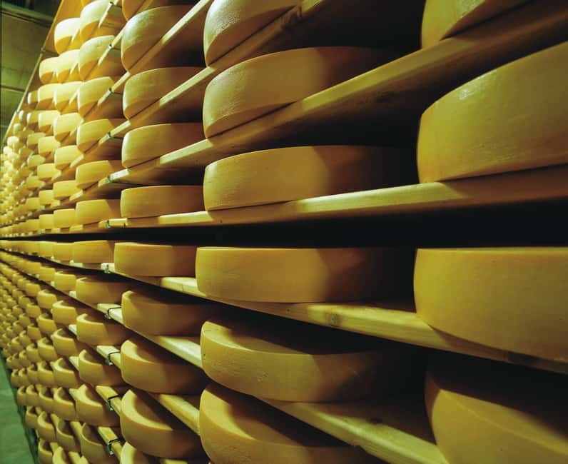 From Lausanne: Gruyères Tour with Train, Chocolate & Cheese - La Maison du Gruyère: seeing the cheese before eating it