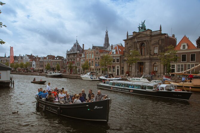 Haarlem Cheese and Wine Cruise - Molen De Adriaan beside the river