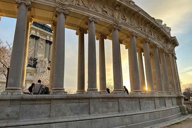 Madrid Bike Tour with Churros and Wine, Ham, and Cheese Upgrade - Entering El Retiro Park on two wheels