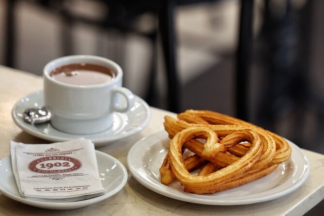 Madrid Bike Tour with Churros and Wine, Ham, and Cheese Upgrade - Churros at Churrería Chocolatería 1902