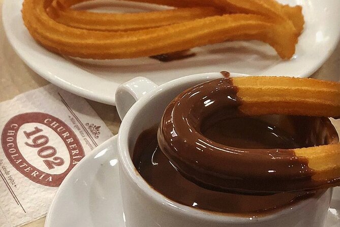 Madrid Bike Tour with Churros and Wine, Ham, and Cheese Upgrade - Gran Vía and the grand city center