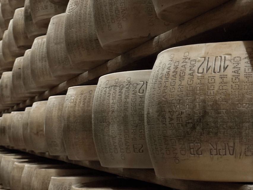 Parmesan Cheese Tour & Tasting in Modena - The aging room and 6,000 wheels