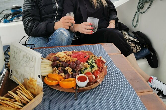 Porto: Wine and cheese tasting on a sailboat on the Douro River - Wine service from Douro bottles to Port