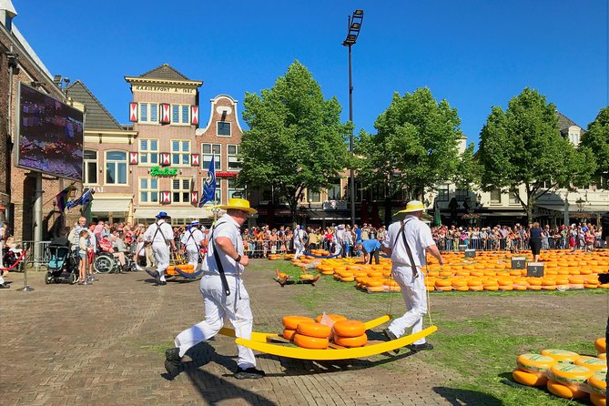 Small Group Alkmaar Cheese Market and City Tour <em>English</em> – Key points to know before booking’ /></p>
<ul>
<li><strong>Cheese carriers in action:</strong> Spend about 90 minutes watching cheese traded, weighed, and moved in a centuries-old market tradition.</li>
<li><strong>A group of six or fewer:</strong> The small size makes it easier to hear Jennifer, ask questions, and get personal help during the market.</li>
<li><strong>A local guide with useful connections:</strong> Jennifer, a Canadian who lives in Alkmaar, knows the market and its participants well.</li>
<li><strong>A proper city walk included:</strong> See the Waag, City Hall, Great St Lawrence Church, canals, cobbled lanes, and Molen van Piet.</li>
<li><strong>Cheese tasting is part of the fun:</strong> You can sample Dutch cheese and buy more for home, though purchases cost extra.</li>
<li><strong>Train-friendly start and central finish:</strong> Meet outside Alkmaar Station at 9 a.m. and finish at Waagplein in the city center.</li>
</ul>
<h2>Why Alkmaar’s cheese market is worth your morning</h2>
<p>English</em> – Why Alkmaar’s cheese market is worth your morning’ /></p>
<p><p>If you have seen a Dutch cheese market only in photographs, Alkmaar gives you a chance to watch the old system work in real time. The market is not simply a food display. It is a public demonstration of a trading custom involving cheese merchants, weighers, and the famous cheese carriers.</p>
</p>
<p><p>Large round wheels are moved across the square, carried in wooden barrows, and taken to the Waag for weighing. The process has a rhythm that can be hard to follow at first. That is where a guide earns the fee. Jennifer explains what is happening as it unfolds, so you can tell the difference between a ceremonial movement and part of the actual market process.</p>
</p>
<p><p>The cheese market is held on Fridays, and the tour begins at 9 a.m. outside Alkmaar train station. That early start matters. It gets you into the city before the tour ends at the Waagplein, and it puts you in position for the morning market activity rather than asking you to find your own way through the crowds.</p>
</p>
<p><p>You spend about an hour and a half at the market. That is enough time to watch several stages of the trading process without turning the entire morning into a single photo stop. You will also have time to look closely, ask questions, take pictures, and try Dutch cheese.</p>
</p>
<div class="twil" style="margin: 20px 0; padding: 15px 0;"><p>More market visits in the Netherlands:</p><ul style="margin: 10px 0; padding-left: 0; list-style: none;"><li style="margin: 0 0 12px 0; padding: 0 0 12px 0; border-bottom: 1px solid #FFF3E2; line-height: 1.4;"><a href="https://fromagetravels.com/amsterdam-traditional-cheese-market-tour-to-alkmaar/">Amsterdam: Traditional Cheese Market Tour to Alkmaar</a><br><span style="font-size: 0.82em; color: #555;"><span style="color: #FFA630;">★</span> 4.2 &nbsp;&middot;&nbsp; 6 reviews</span></li><li style="margin: 0 0 12px 0; padding: 0 0 12px 0; border-bottom: 1px solid #FFF3E2; line-height: 1.4;"><a href="https://fromagetravels.com/from-amsterdam-alkmaar-cheese-market-zaanse-schans/">From Amsterdam; Alkmaar Cheese market & Zaanse Schans</a><br><span style="font-size: 0.82em; color: #555;"><span style="color: #FFA630;">★</span> 4.8 &nbsp;&middot;&nbsp; 4 reviews</span></li><li style="margin: 0; padding: 0; border-bottom: none; line-height: 1.4;"><a href="https://fromagetravels.com/basel-farmers-market-cheese-chocolate-pastry-tour/">Basel Farmer’s Market, Cheese, Chocolate & Pastry Tour</a><br><span style="font-size: 0.82em; color: #555;"><span style="color: #FFA630;">★</span> 4.5 &nbsp;&middot;&nbsp; 171 reviews</span></li></ul></div><h2>Starting at Alkmaar Station with Jennifer</h2>
<p><img width="669" height="446" decoding="async" src=
